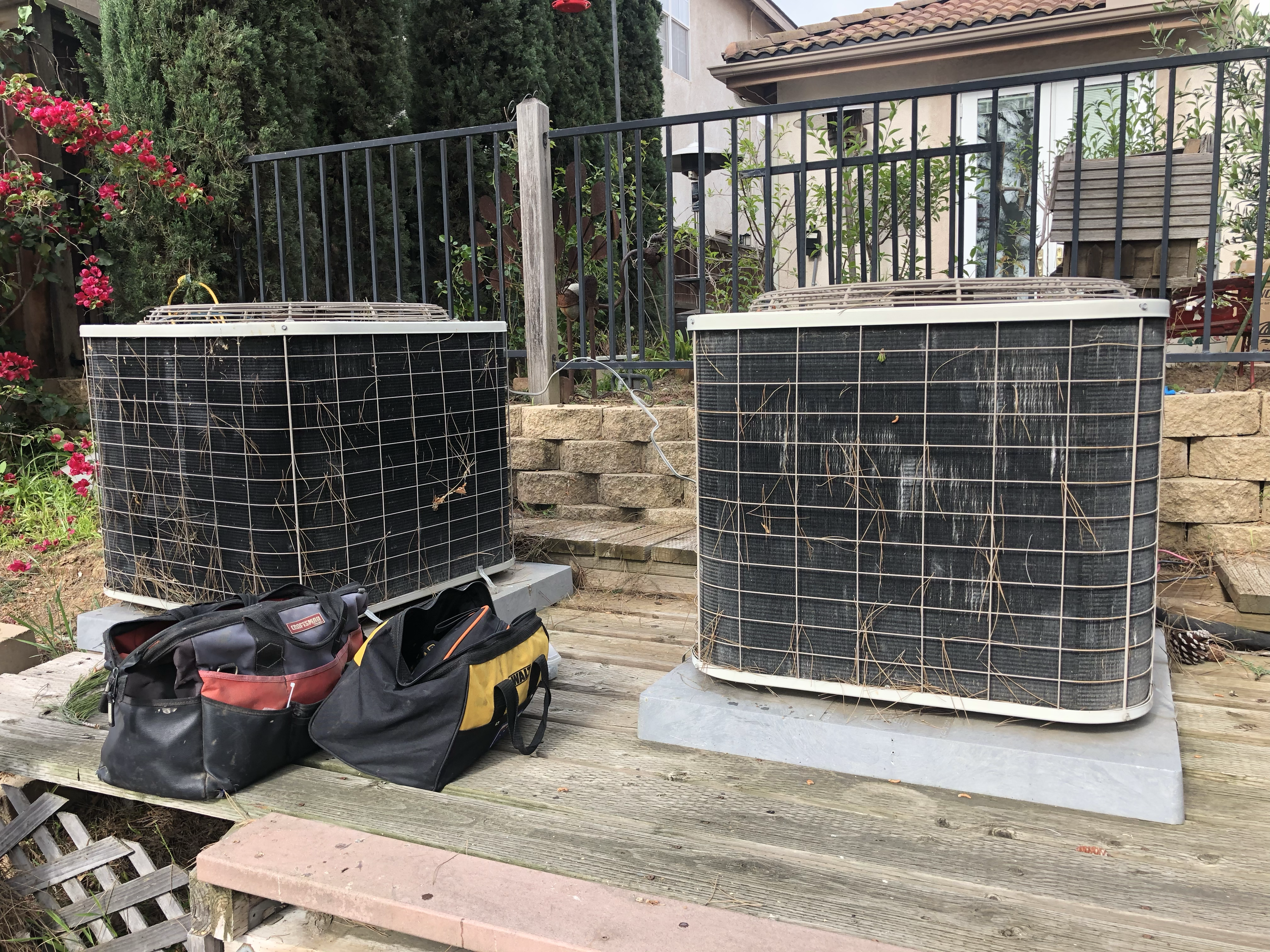 Two outdoor air conditioning condenser units